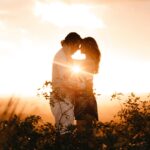 Couple Standing Beside Plants during Golden Hour