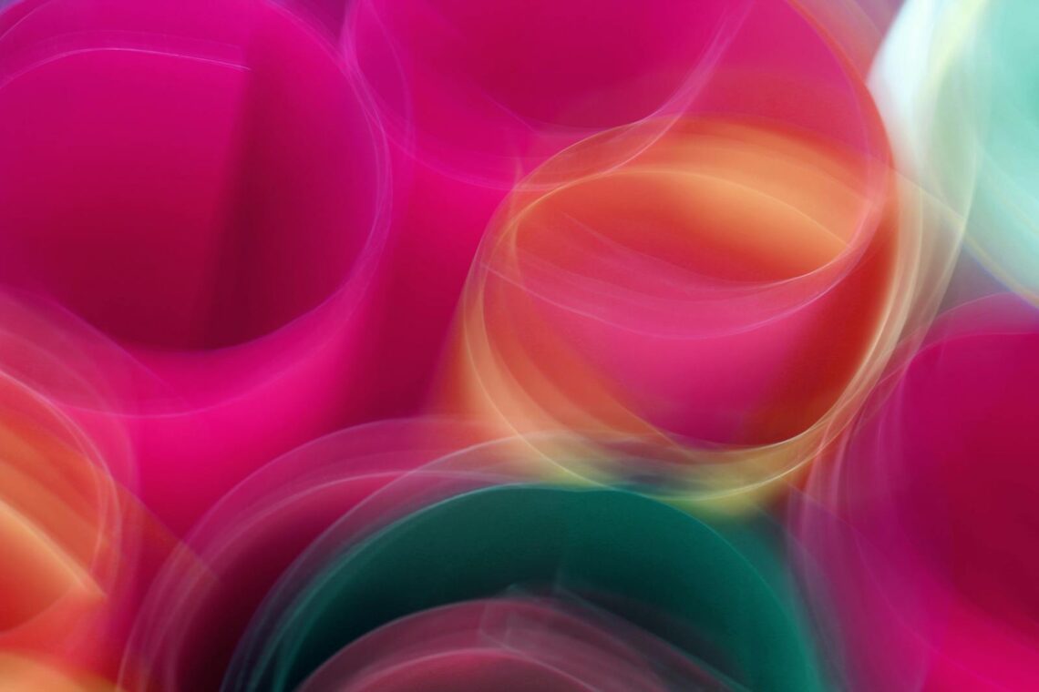 Abstract motion blur of colorful circles creating a vibrant, dynamic visual.