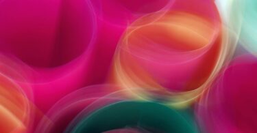 Abstract motion blur of colorful circles creating a vibrant, dynamic visual.