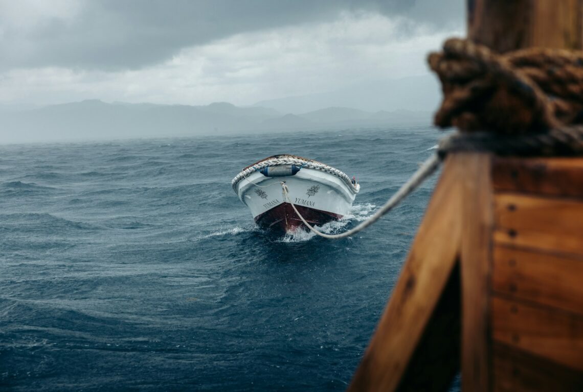 A boat in the middle of a large body of water